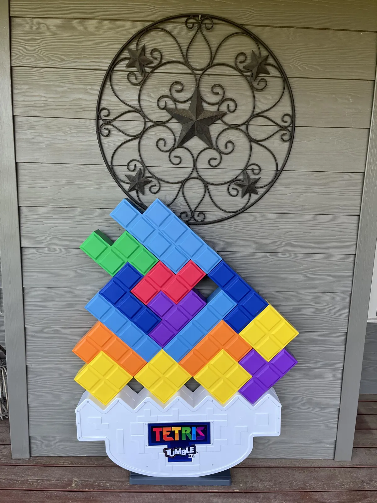 A fun, playful area with a Tetris game display and vibrant decorative wall art, suggesting a space designed for enjoyment, games, and gathering with loved ones.